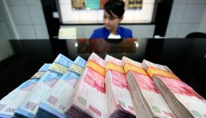 Minim Sentimen Positif Rupiah Mixed ke Level Rp13.556 Per Dolar AS