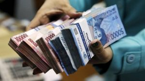 Rupiah Dibuka Melemah di Rp14.085 per Dollar AS