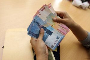 Rupiah Melemah ke Rp14.127/USD di Tengah Keperkasaan Dolar