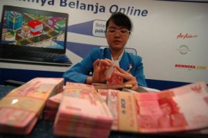 Rupiah Bergerak Melemah ke Rp14.066/USD